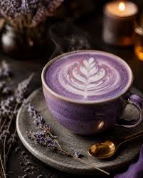 Violet lavender latte with delicate foam art, lavender sprigs and candlelight